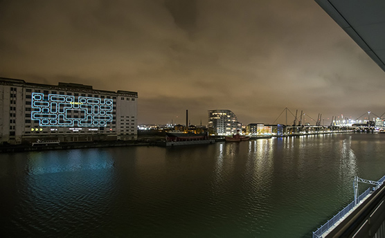 Custom version of Pac-Man projected across the River Thames