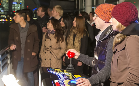Jason Bradbury and Rachel Riley playing Pac-Man on a custom arcade cabinet